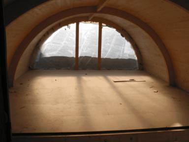 Maison contemporaine en bois - comble sous toiture plein cintre